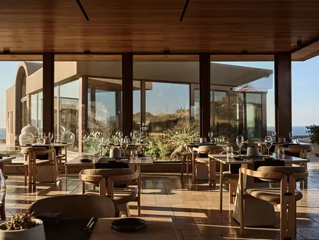 Cremnos restaurant terrace at Acro Suites overlooking the Aegean.