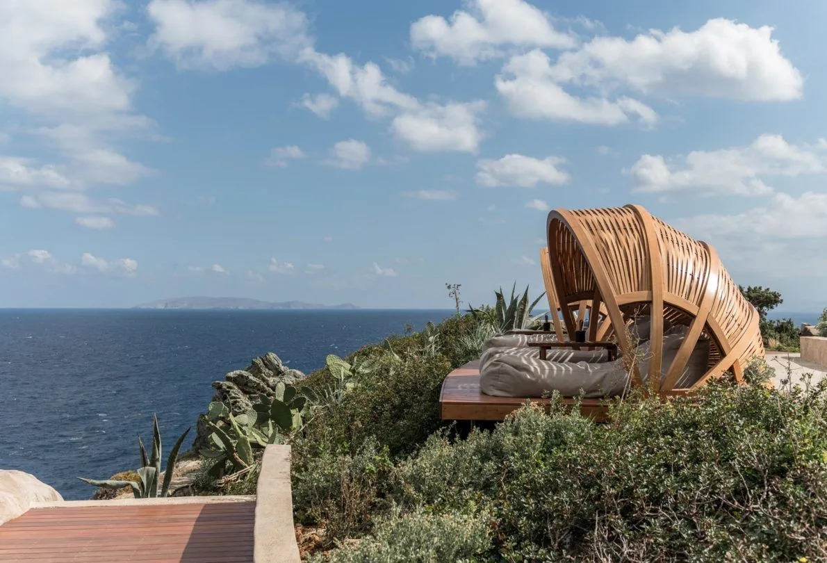 Volcanic stone and Corten steel architecture at Acro Suites.
